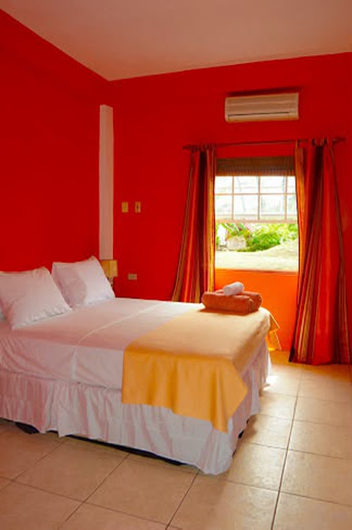 Sandbank's queen bed, with a window onto the garden